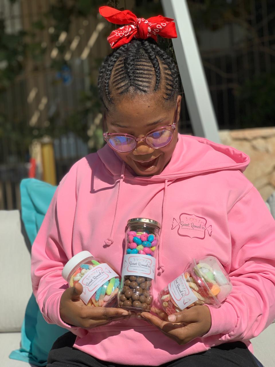 Sweet Remedie Mukundi Mphohoni Posing Packaged Container Sweets